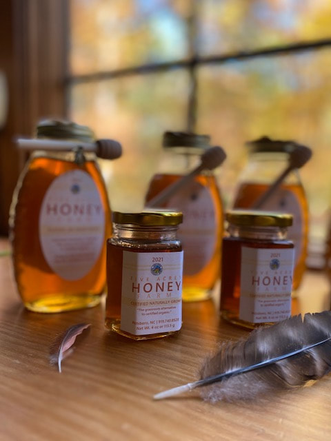 jars of honey on a window sill